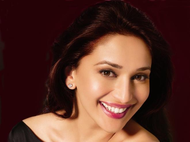 Madhuri Dixit disrupts her shoot to save seven puppies